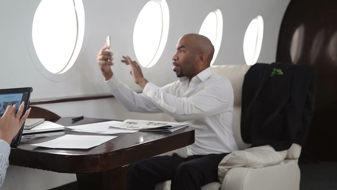 Travellers talking together in a private jet cabin